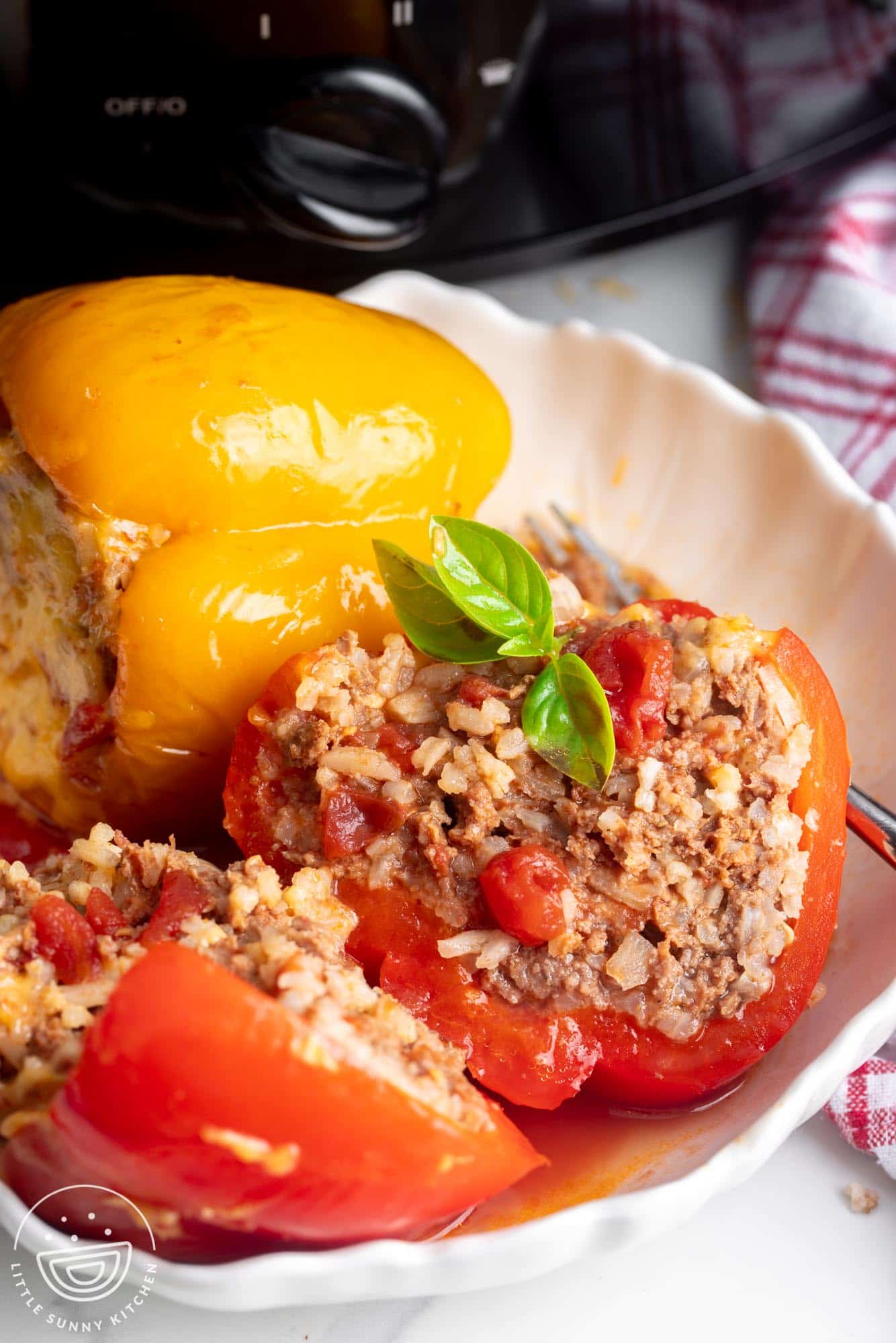 a slow cooker pepper stuffed with meat and rice, cut in half.