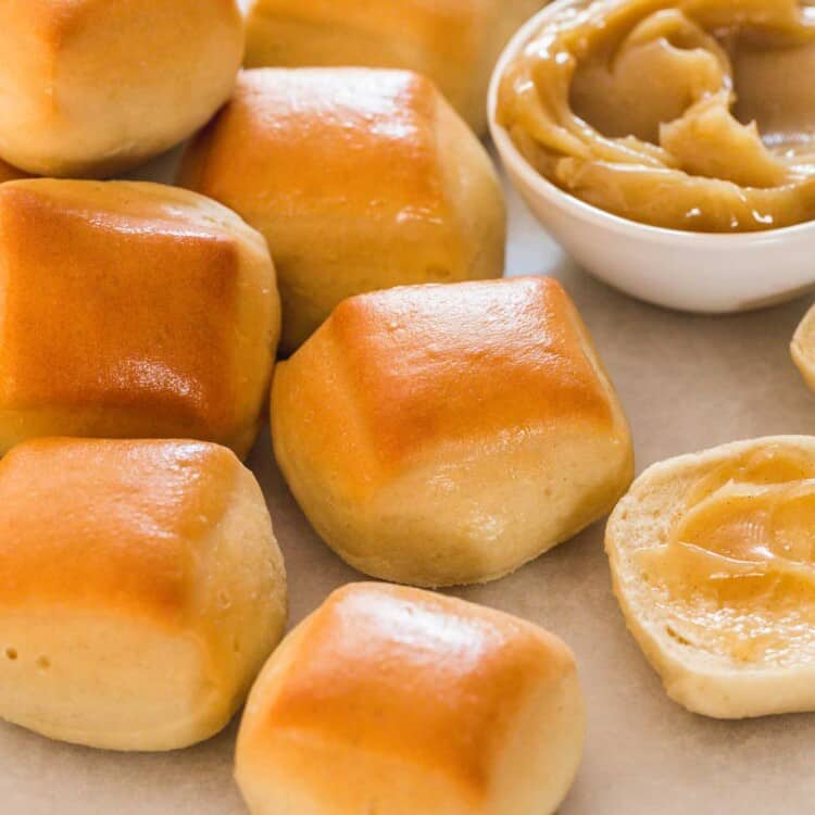 A few Texas roadhouse rolls served with cinnamon honey butter on the side
