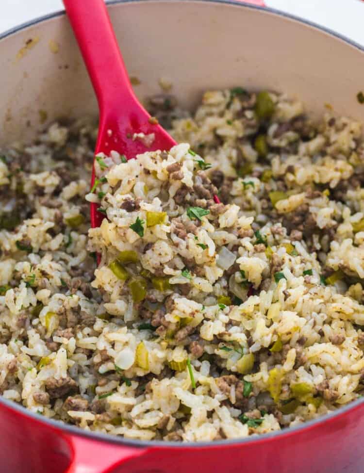 Cajun dirty rice in a red le creuset dutch oven
