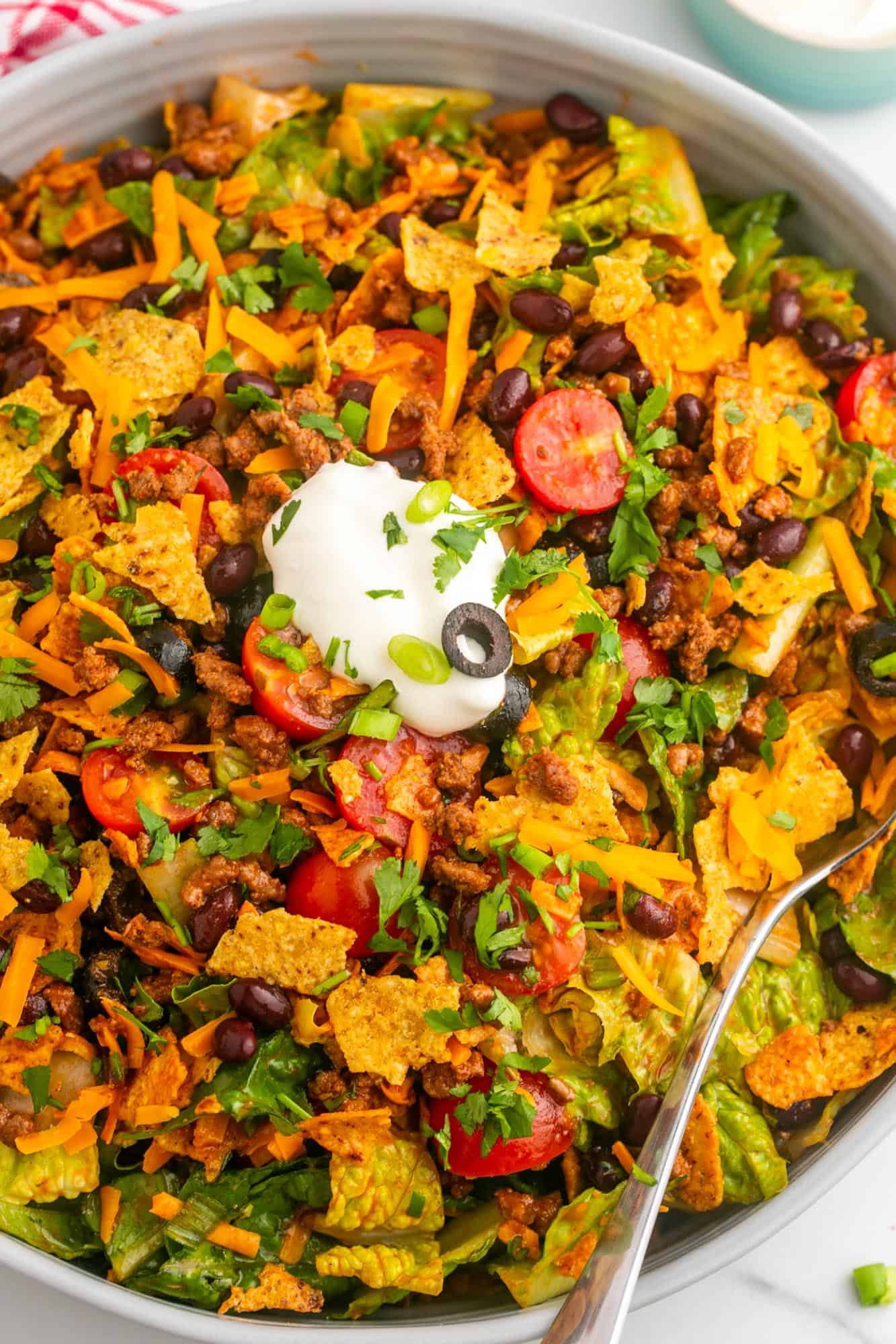 Overhead shot of dorito taco salad in a large salad bowl