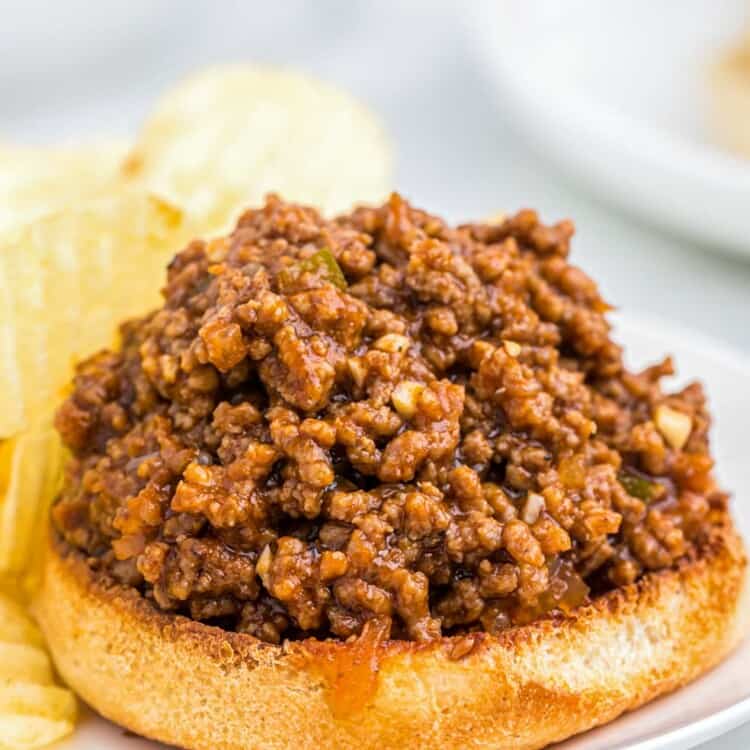 Sloppy joe on a half bun served with chips