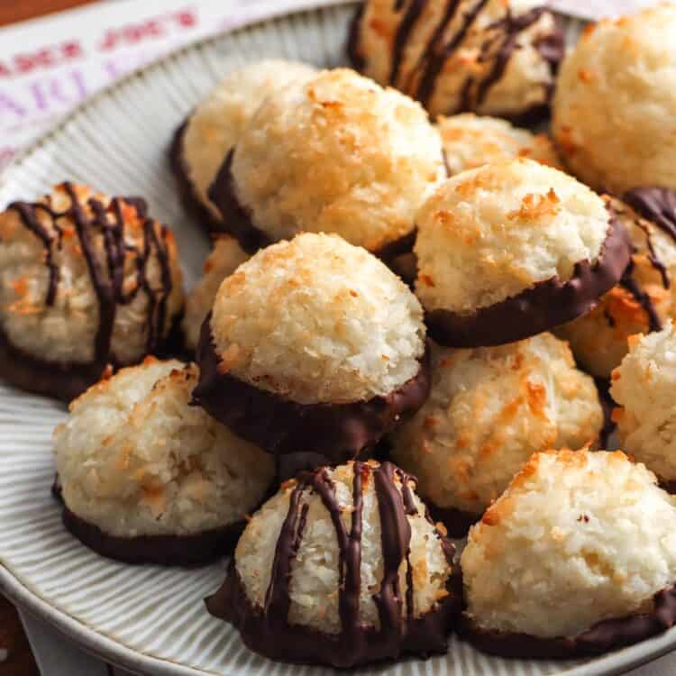 a plate of coconut macaroons on top of a newspaper.